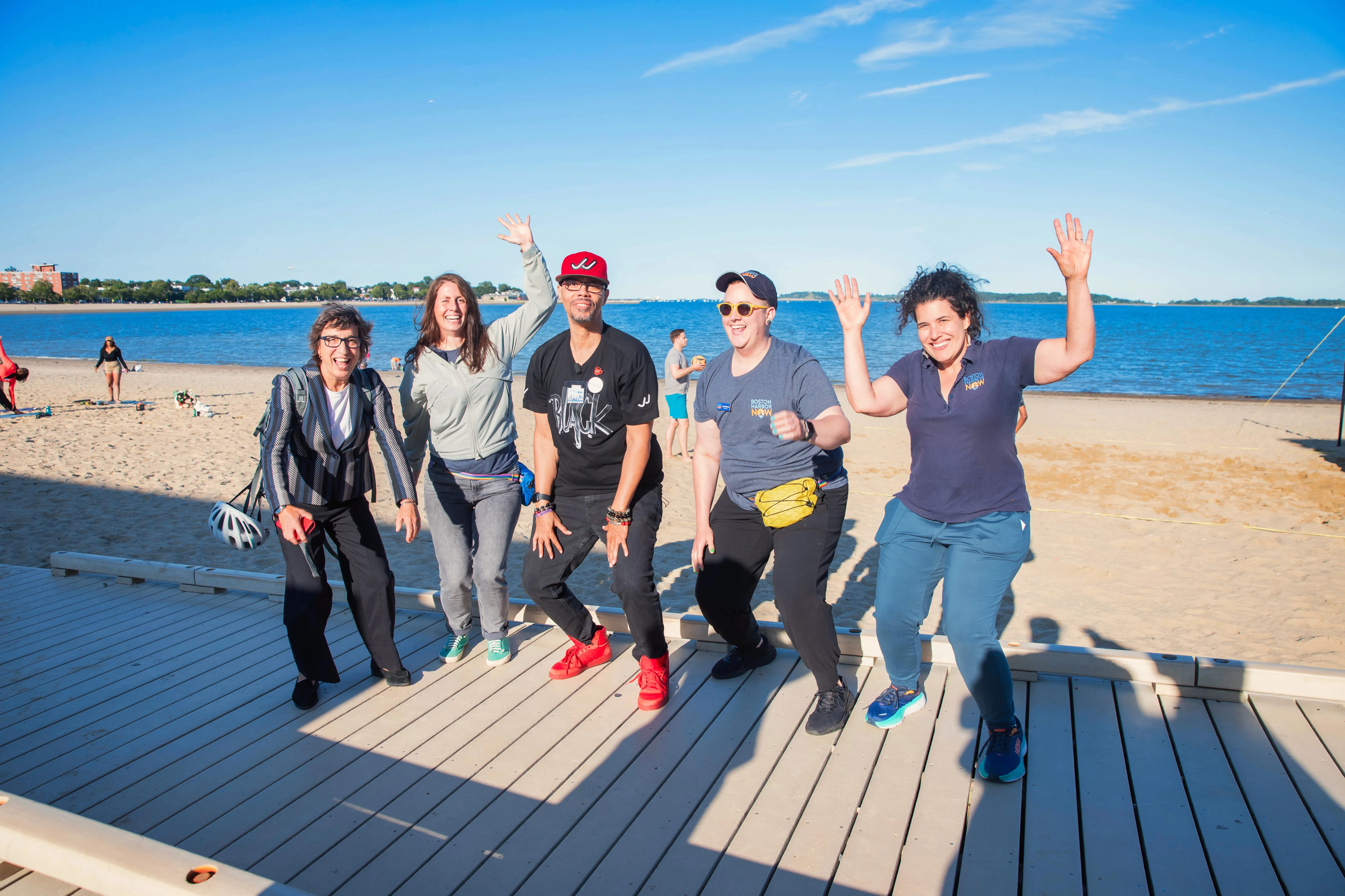 A group of people posing for a picture at Carson Beach during a Java With Jimmy event