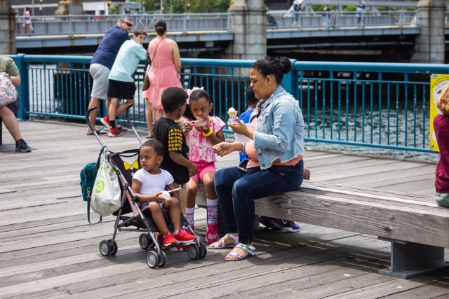 family enjoying ice cream on the waterfront